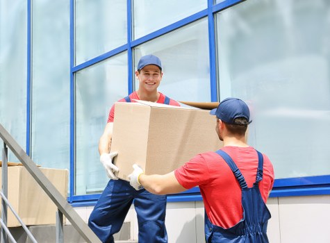 Removal team handling a flat move in Shepherds Bush with furniture protection