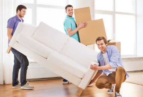 Removal truck loading furniture and boxes for a flat move in Shepherds Bush