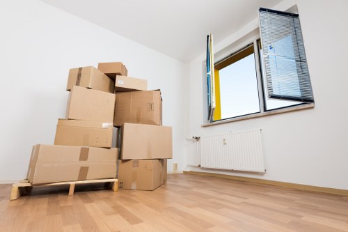 Students moving boxes and furniture in Shepherds Bush