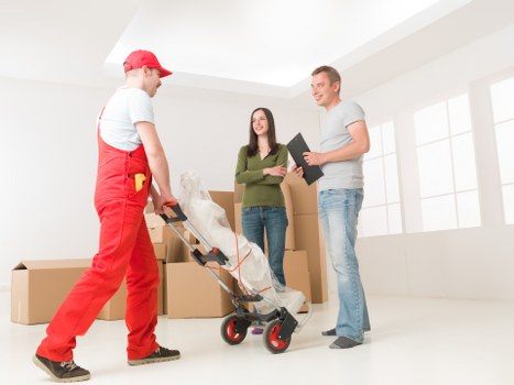 Protective wrapping and planning for a piano move in a Shepherds Bush flat