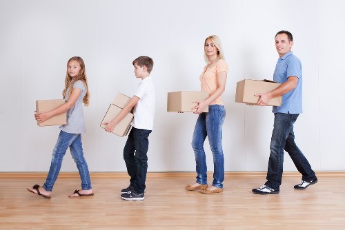 Loading boxes and furniture into a removals van in West London