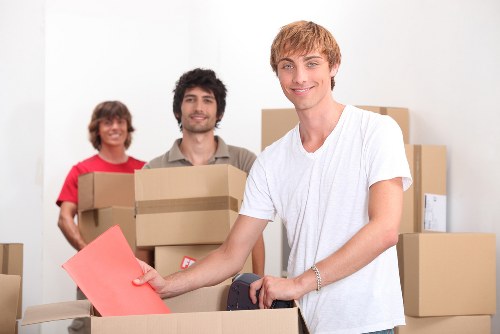 Careful lifting of household items in a West London property